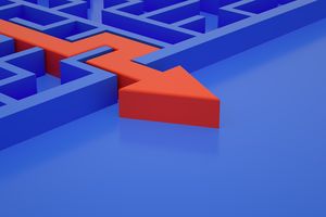 A 3D-rendered image showing a blue maze with thick walls and a smooth surface. Cutting through the maze is a large, bright red arrow that breaks through the walls in a straight path, symbolizing a direct solution or shortcut. The arrow starts inside the maze and exits through the outer wall, contrasting sharply against the blue background. The perspective is angled, giving depth to the maze structure and emphasizing the arrow’s bold, disruptive movement.